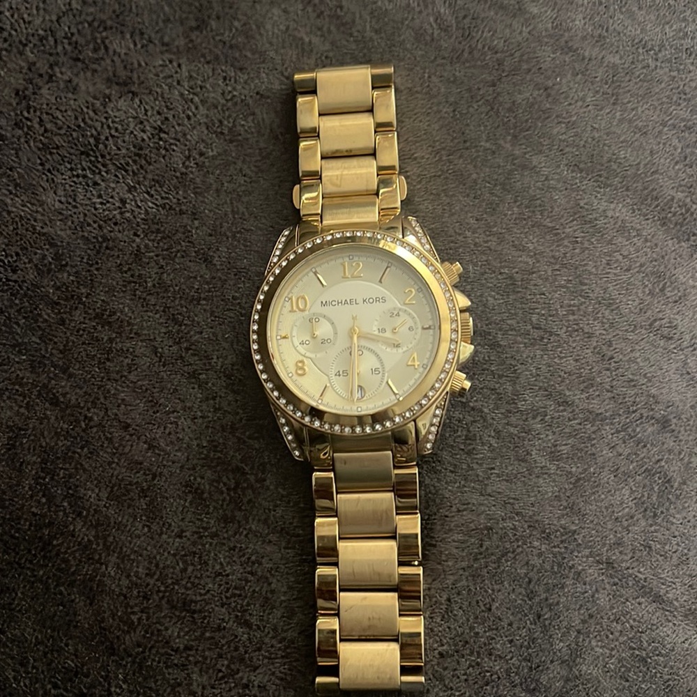 Gold and diamond Michael Kors large gold watch.